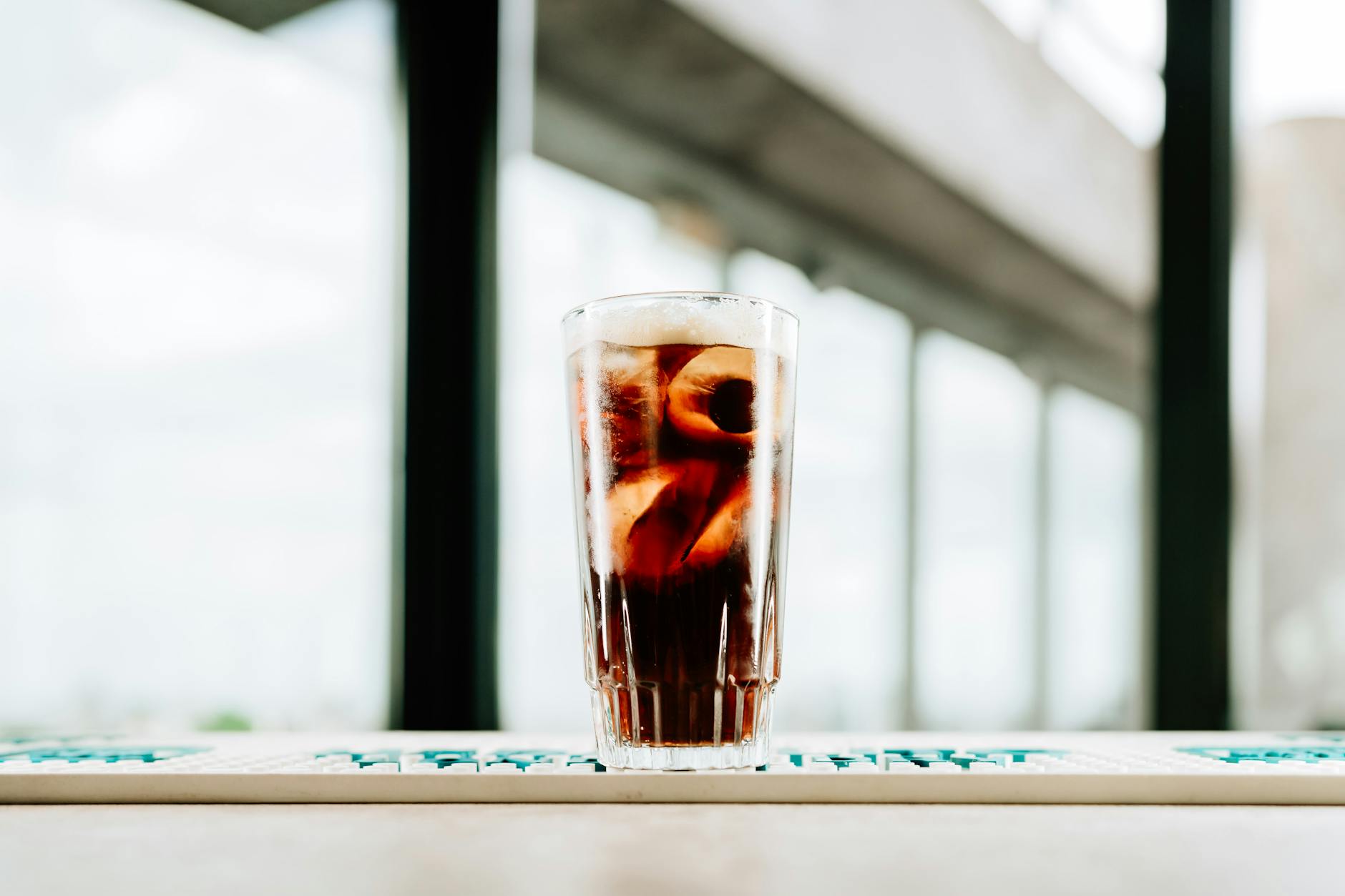 Chilled glass of fernet with ice on a rooftop bar in Buenos Aires, Argentina.