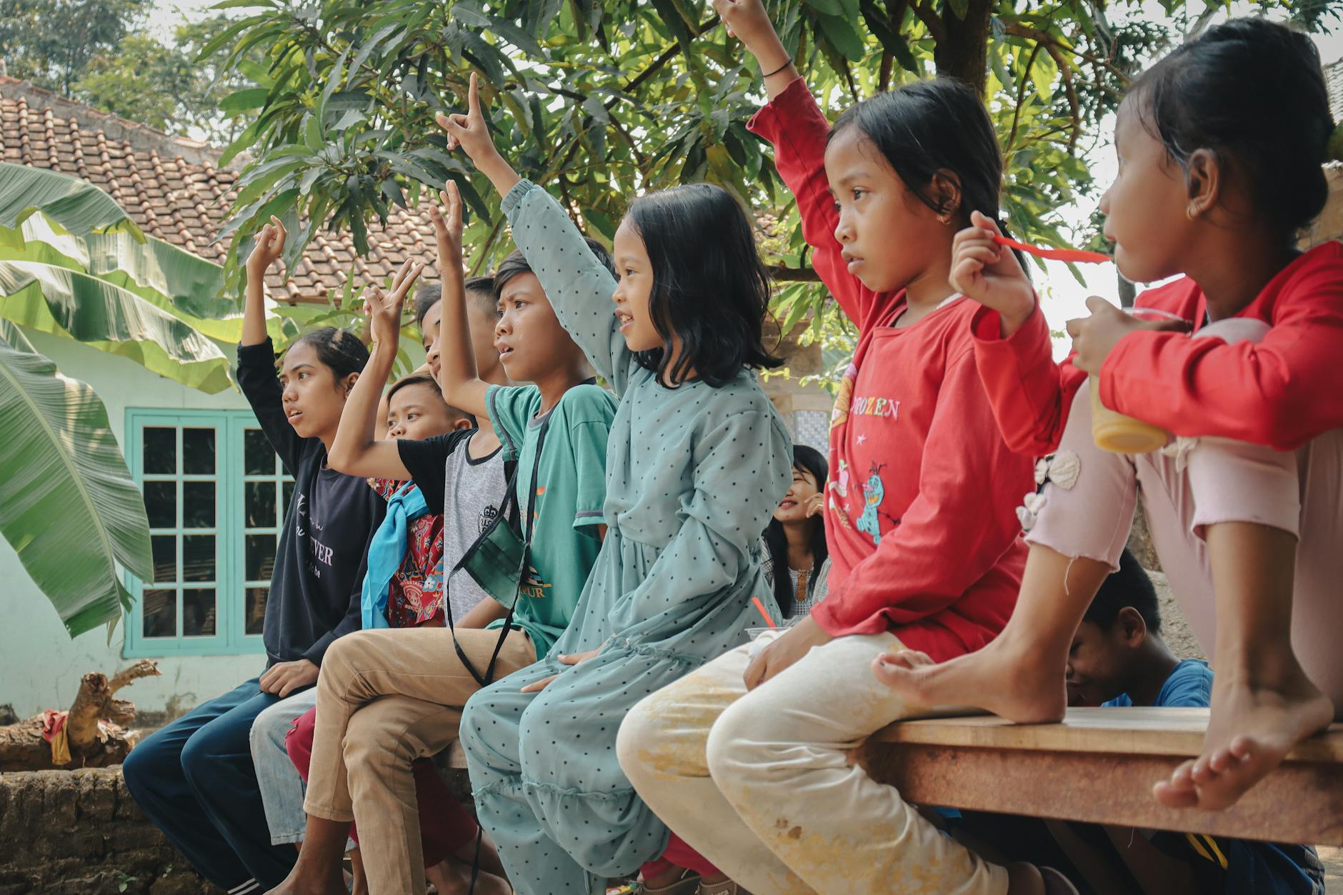 Children participating in a fun quiz in a village setting in West Java, Indonesia.