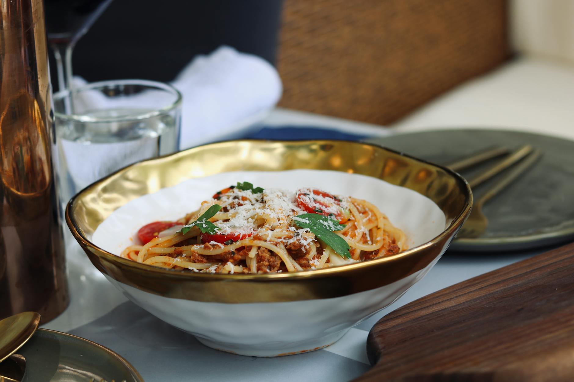 Close-up of a gourmet spaghetti bolognese dish served in an elegant bowl, perfect for food photography.