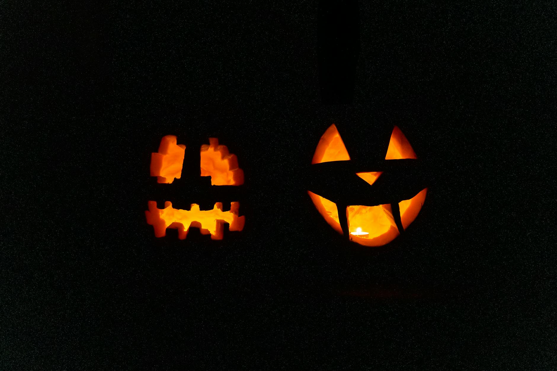 Brightly carved jack-o'-lanterns illuminate the Halloween night with spooky charm.