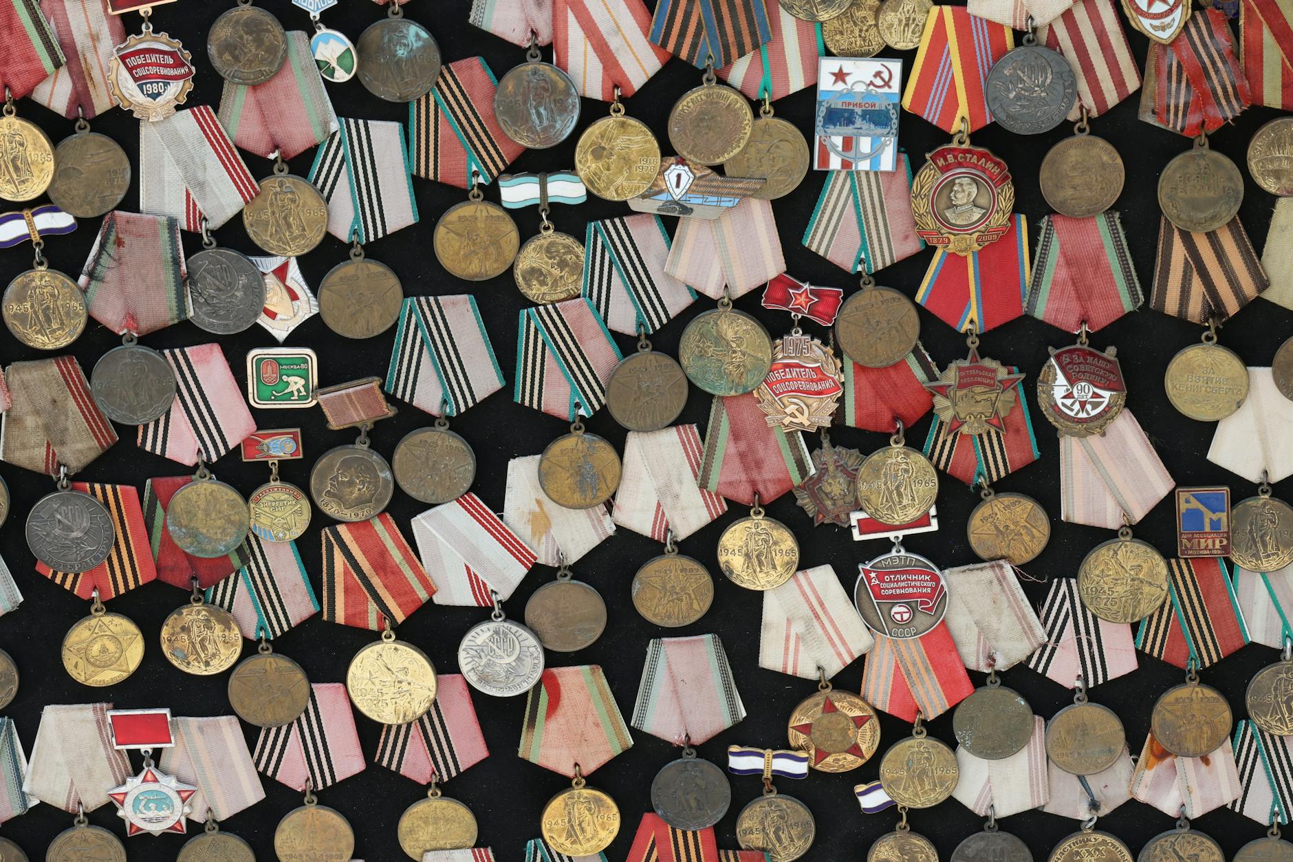 Assortment of Soviet military medals with vibrant ribbons.
