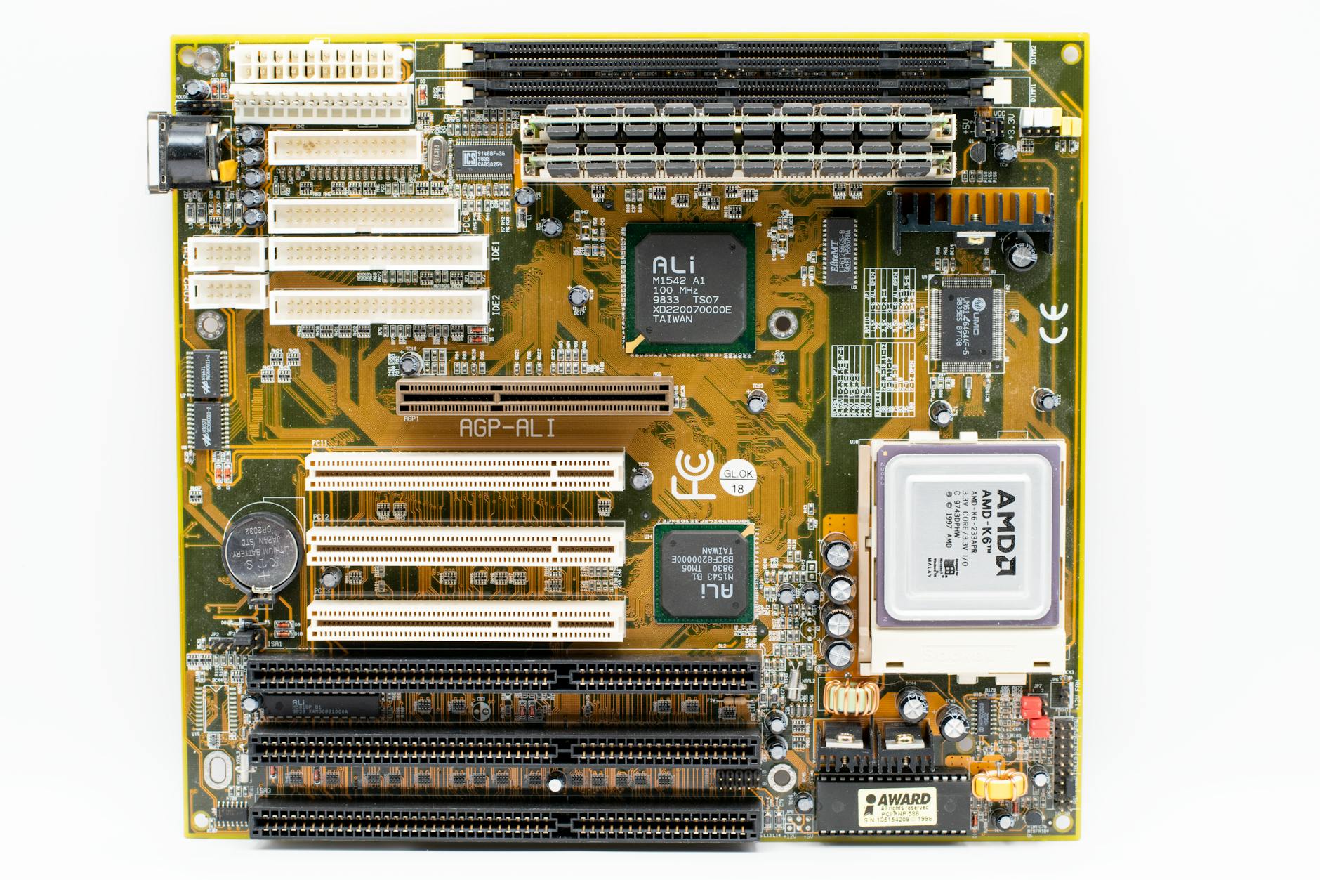 High-angle view of a vintage AMD motherboard showcasing PCI and AGP slots.
